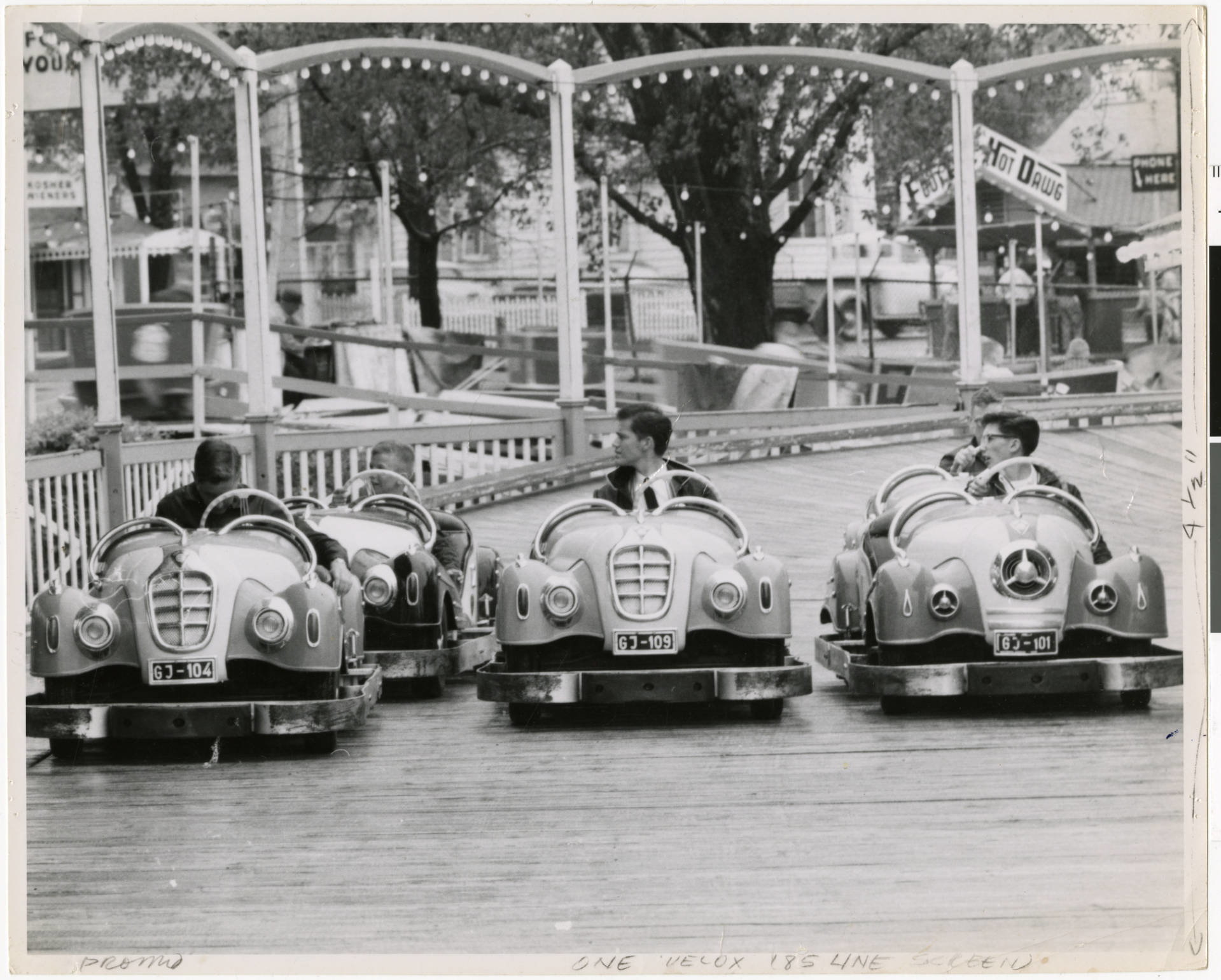 Children sitting in Hot Rods waiting for the go signal at the Excelsior Amusement Park
